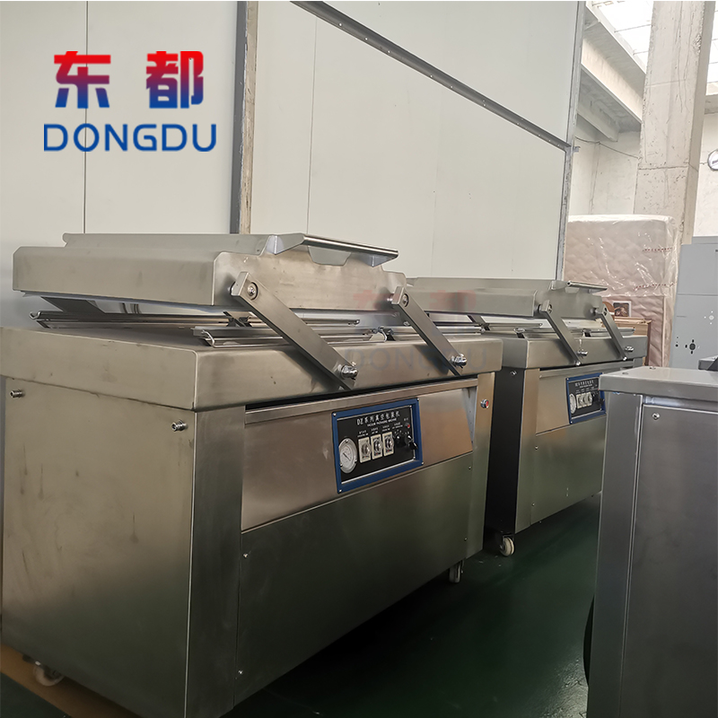 600/800 dual chamber rotating packaging machine multifunctional rice vacuum packaging machine Dongdu vacuum sealing equipment