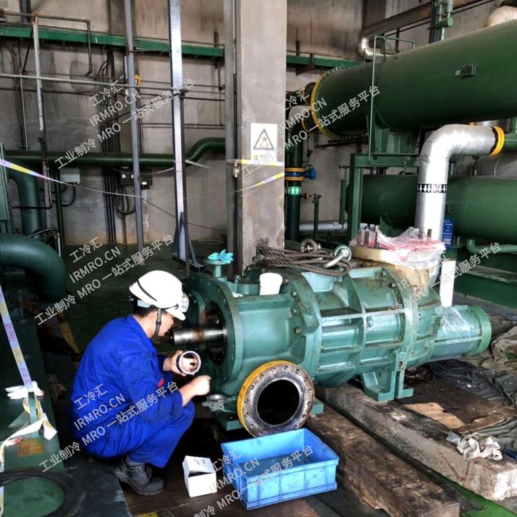 Industrial refrigeration centrifugal compressor fault repair worker cold sink provides propane refrigerator overhaul and maintenance