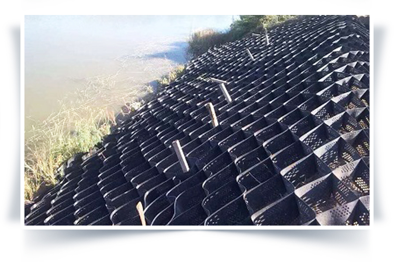 Framework slope protection, soil reinforcement, geotextile cell, embossing and punching, desert grass planting, ecological greening, and honeycomb restraint system network