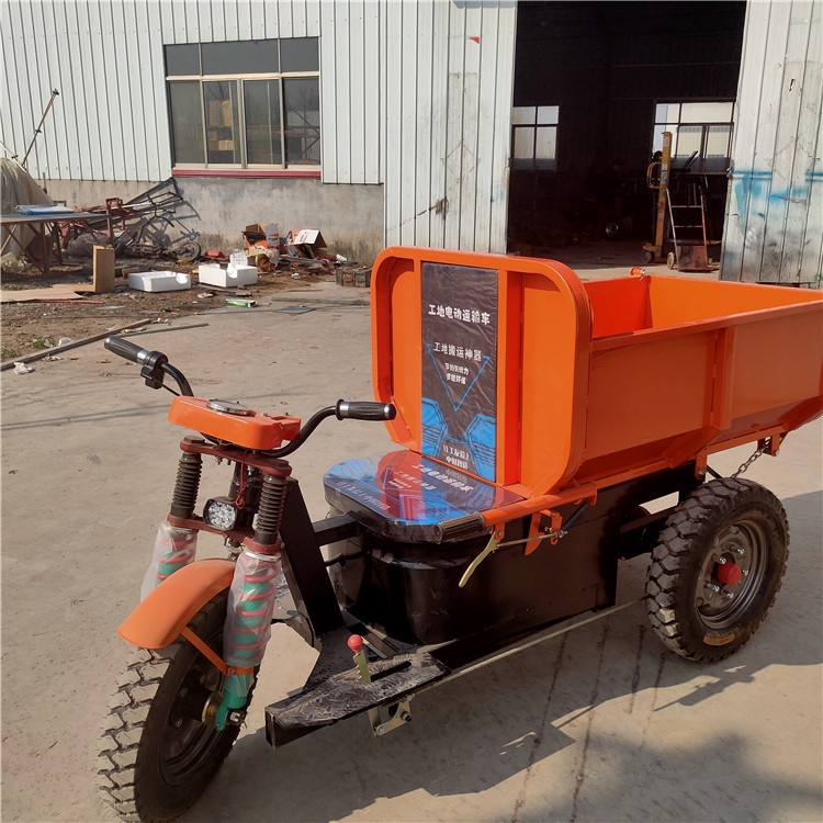 Hand propelled tricycle at construction site, new morning elevator, concrete hauling truck, large cavalry gray hopper truck