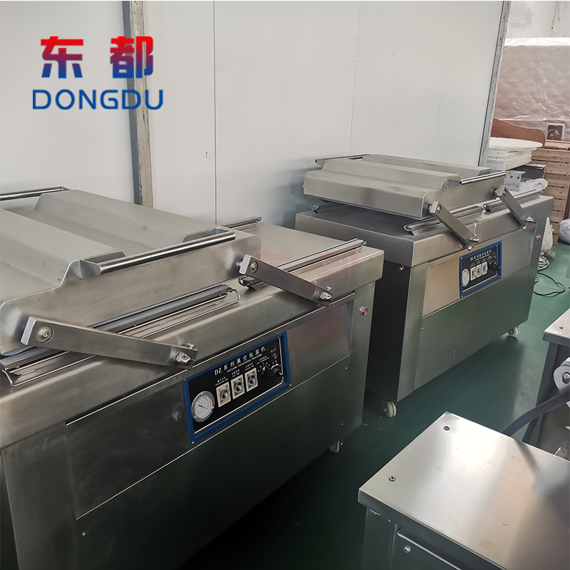 600/800 dual chamber rotating packaging machine multifunctional rice vacuum packaging machine Dongdu vacuum sealing equipment