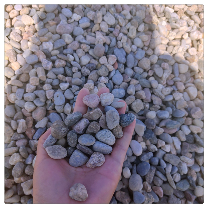 River pebbles, paving stones, water treatment transformers, oil tanks, landscaping, natural pebbles