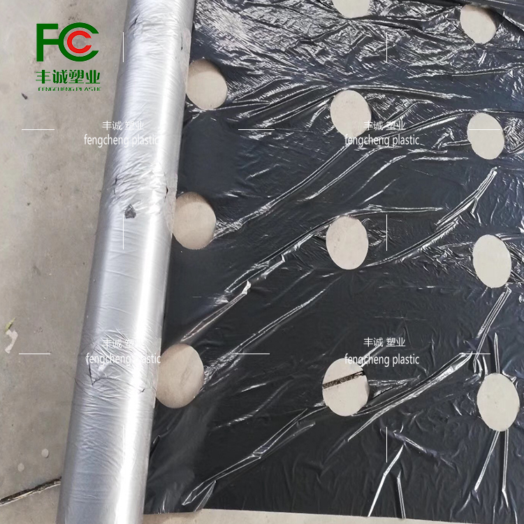 Agricultural perforated plastic film for weeding, insulation and moisturizing, black silver black and white perforated film