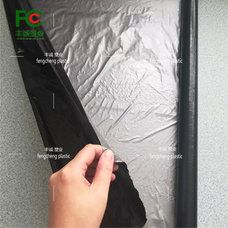 Agricultural perforated plastic film for weeding, insulation and moisturizing, black silver black and white perforated film