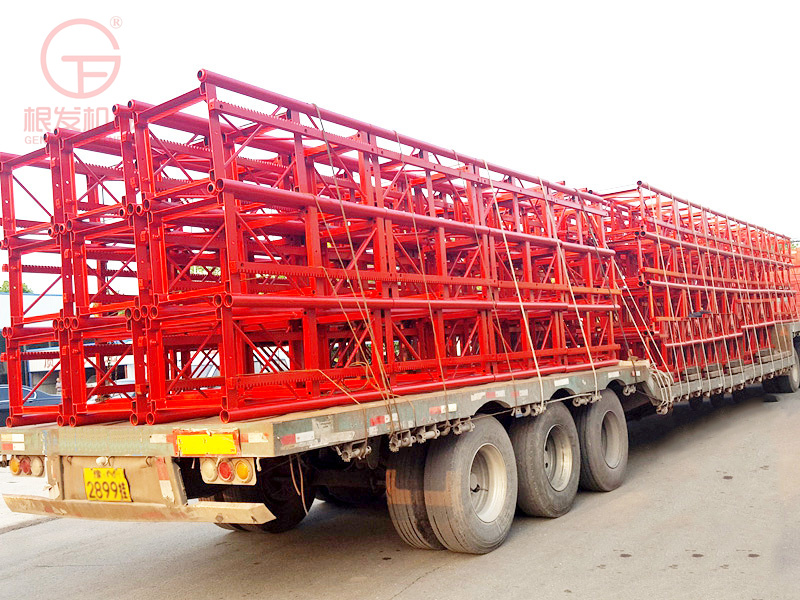 Fix one column and two cages with a construction material elevator on the construction site. Safety of construction elevators for preventing falling, single occupancy, and double cages