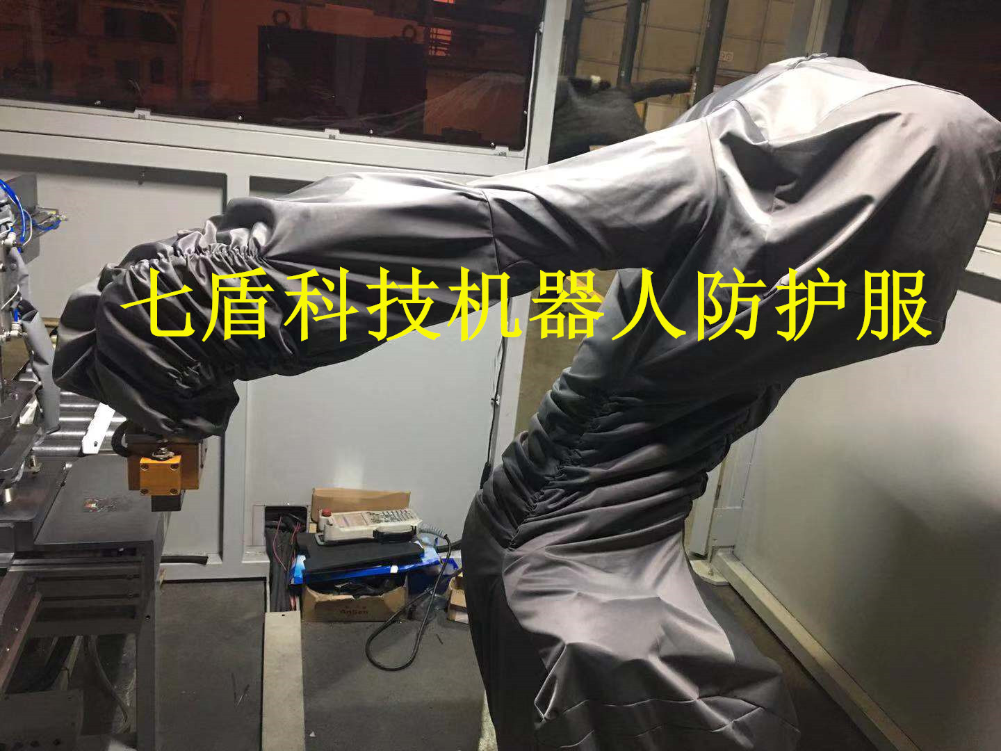 Blue, gray, silver Fanuc R-2000iC210R robot protective suit, Seven Shield Technology