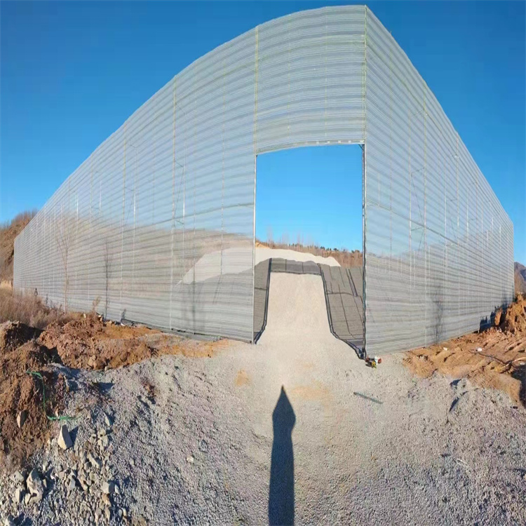 The 15 meter high windbreak wall can be designed and installed with perforated metal galvanized sheet for wind and dust suppression nets