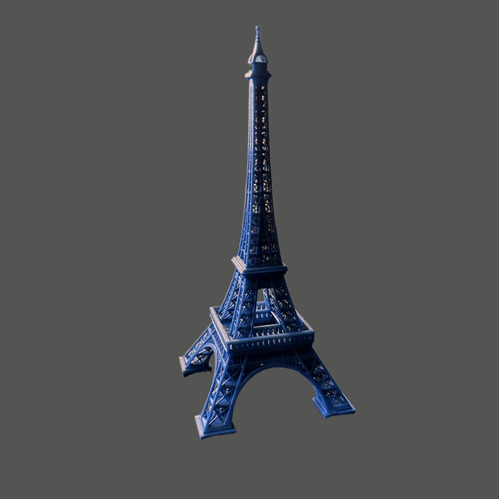 Professional personnel produce blue Eiffel Tower with quality assurance services in place