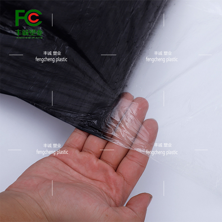 Reflective agricultural insulation, moisture retention, pest control, and grass prevention black and white film for vegetable orchards with alternating black and white film