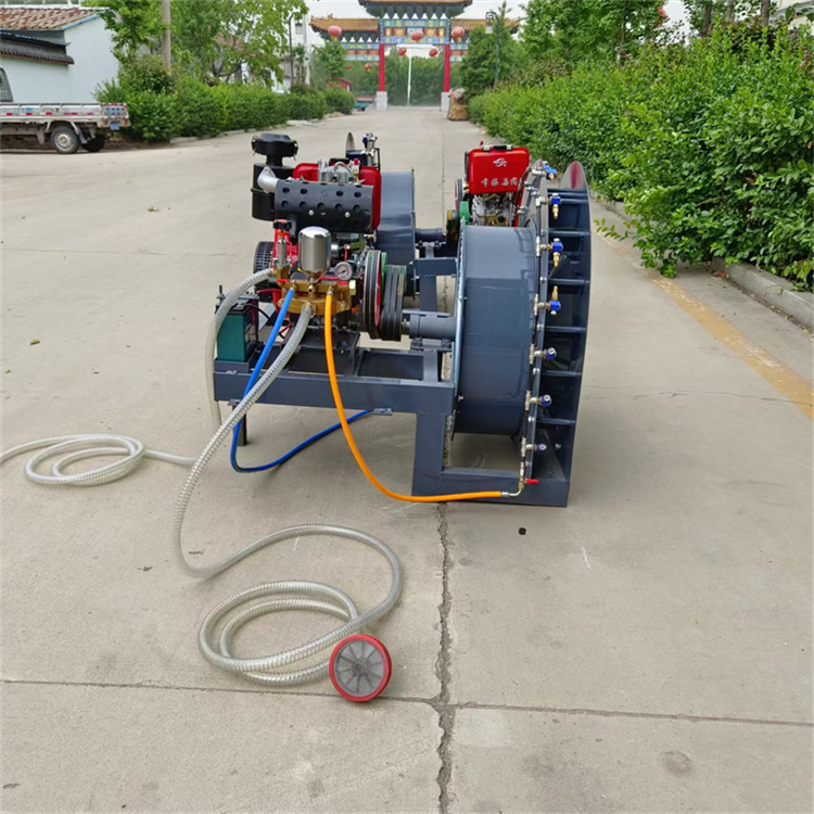 Orchard pesticide sprayer in the morning three wheeled rear air driven pesticide sprayer atomizes diesel spray