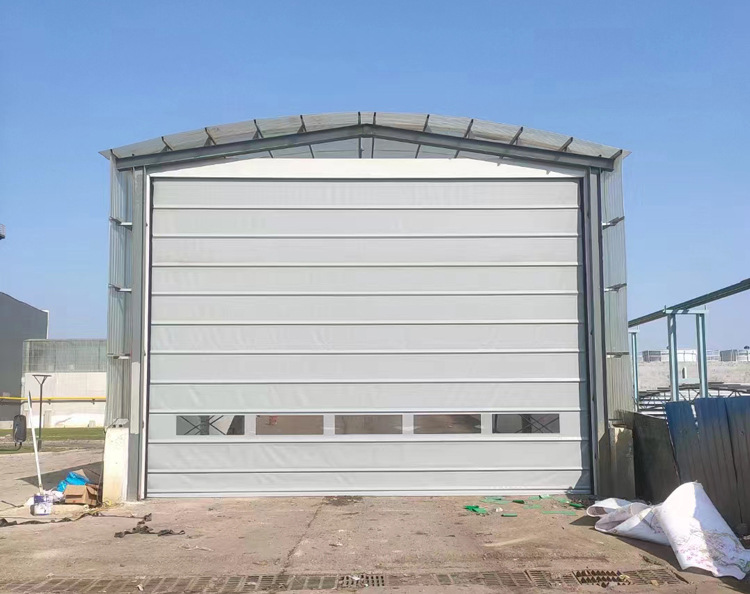 Manufacturer of automatic induction high-speed lifting doors for dustproof doors in large workshops of cement factories with fast stacking doors