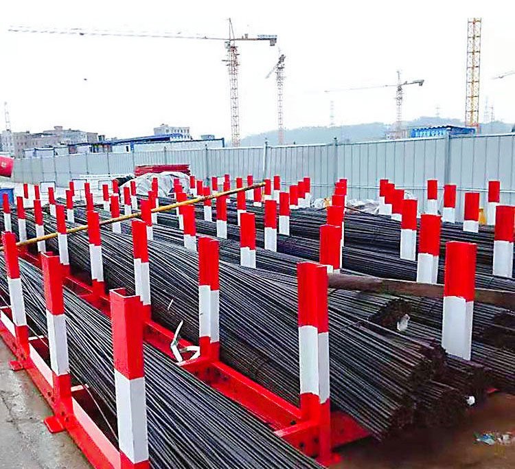 Scaffolds for placing steel bars on the construction site. Stacking of steel bars on the construction site. Scaffolds for steel bars on the construction site. Ruishuo has a large stock of steel bars in stock