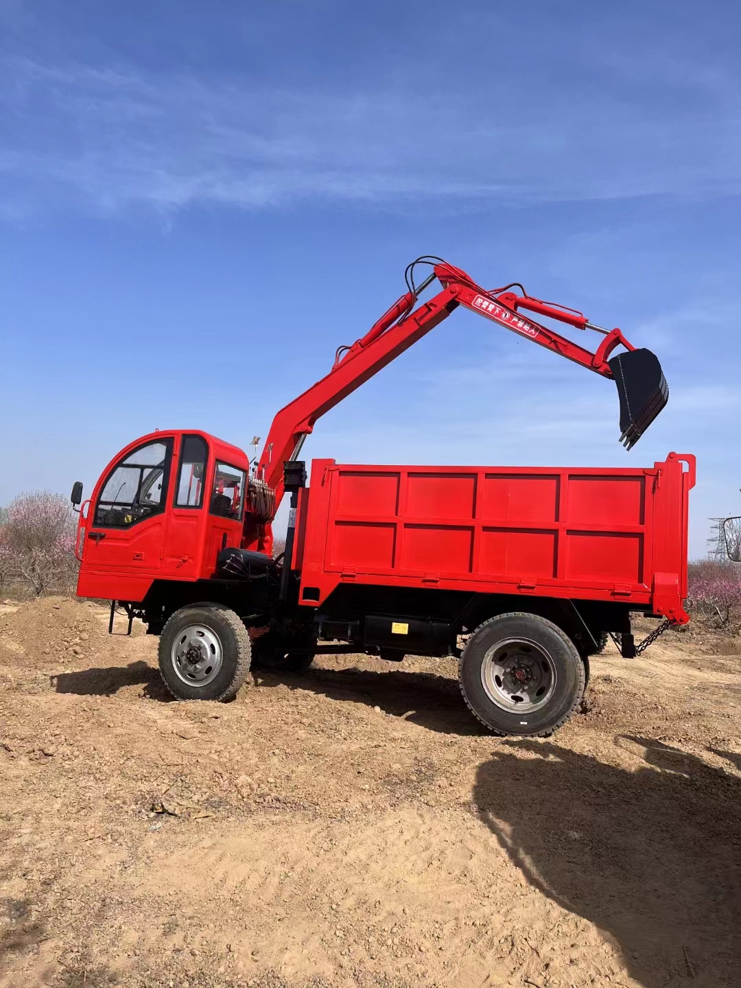 Truck mounted excavator for digging, loading, and transportation in the sand field