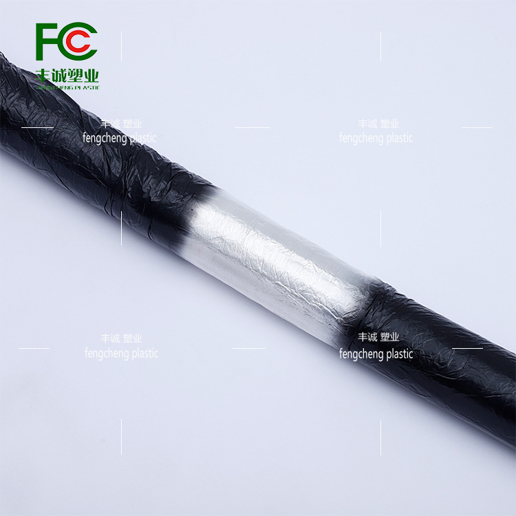 Reflective agricultural insulation, moisture retention, pest control, and grass prevention black and white film for vegetable orchards with alternating black and white film