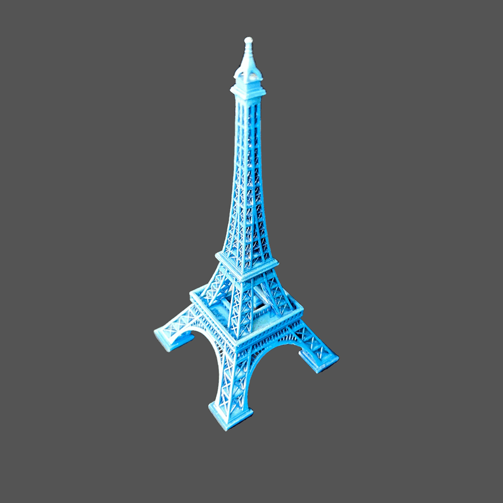 Professional personnel produce blue Eiffel Tower with quality assurance services in place