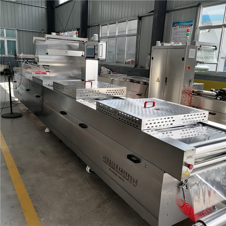 Full automatic stretch film Vacuum packing equipment Food continuous Vacuum packing stainless steel packaging machine