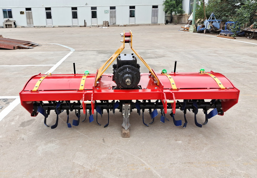 Four wheeled tractor with rotary tiller, agricultural land plowing and loosening machine, field breaking machine