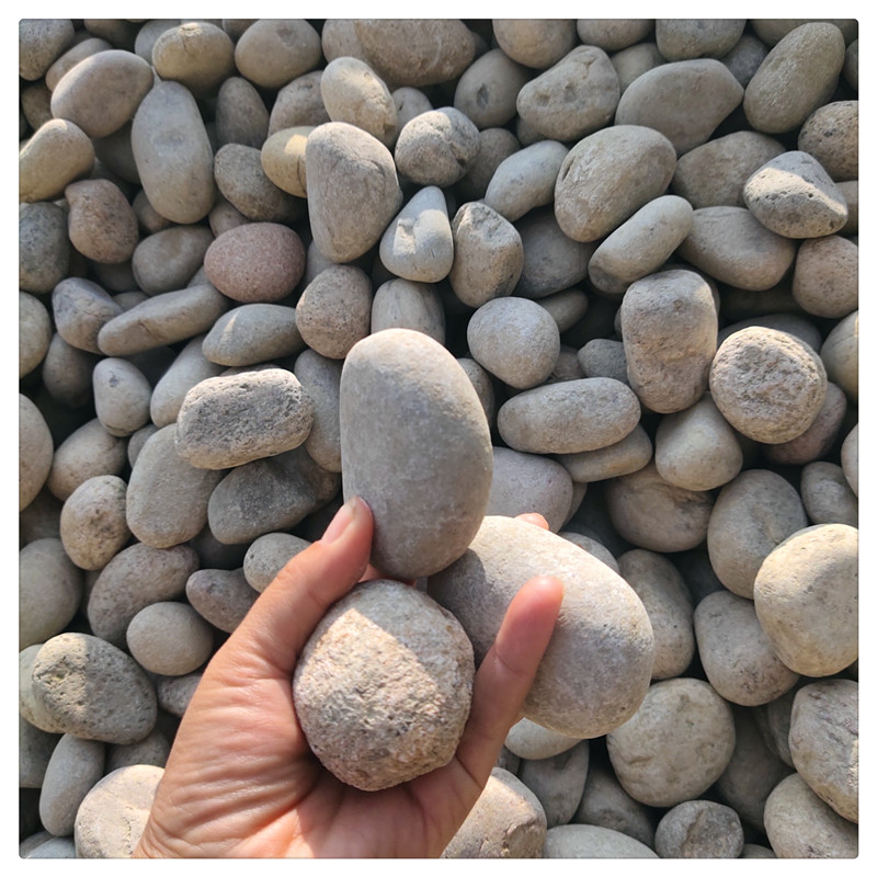 River pebbles, paving stones, water treatment transformers, oil tanks, landscaping, natural pebbles